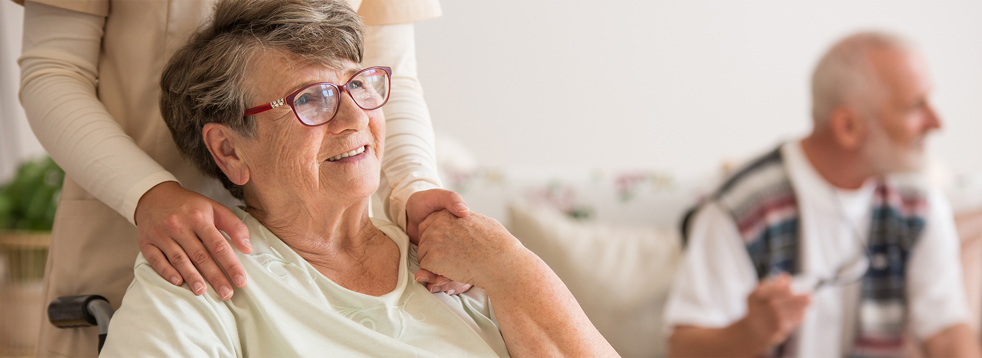 Kindhearted Nursing Solutions Fresno CA Elderly Lady On Wheelchair Holding Hands with Nurse 1